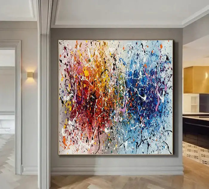 Vibrant hand-painted abstract canvas art in a modern interior, featuring colorful splashes and elegant design.
