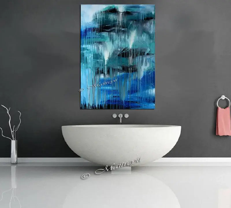Luxury Modern Home Decor featuring handmade abstract wall art in blue tones above a white modern bathtub.