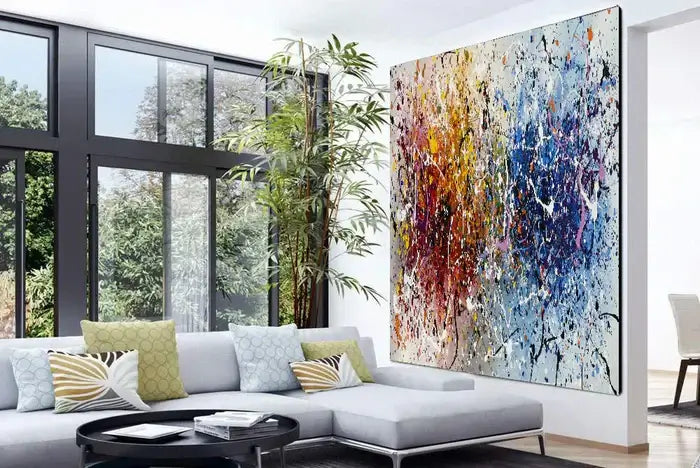 Vibrant hand-painted canvas art on wall in modern living room, featuring colorful abstract design and elegant decor.