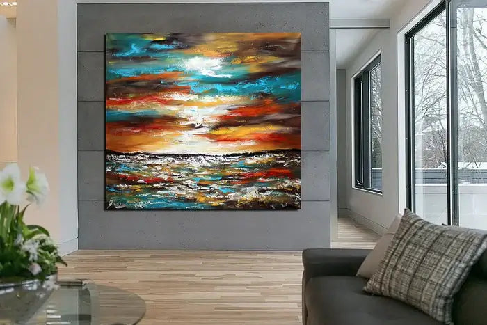 Large oil painting of an ocean sunset, vibrant colors, modern wall decor for coastal and beach homes.