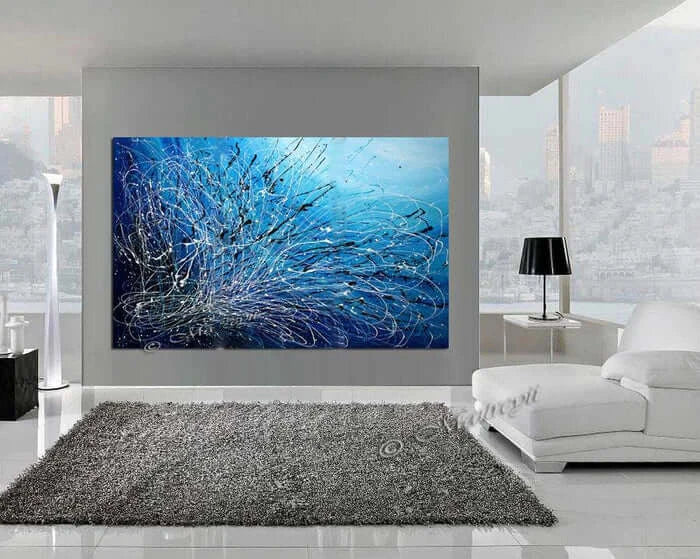 Blue Modern Art For Luxury Homes displayed in a stylish living room with contemporary decor and a plush rug.
