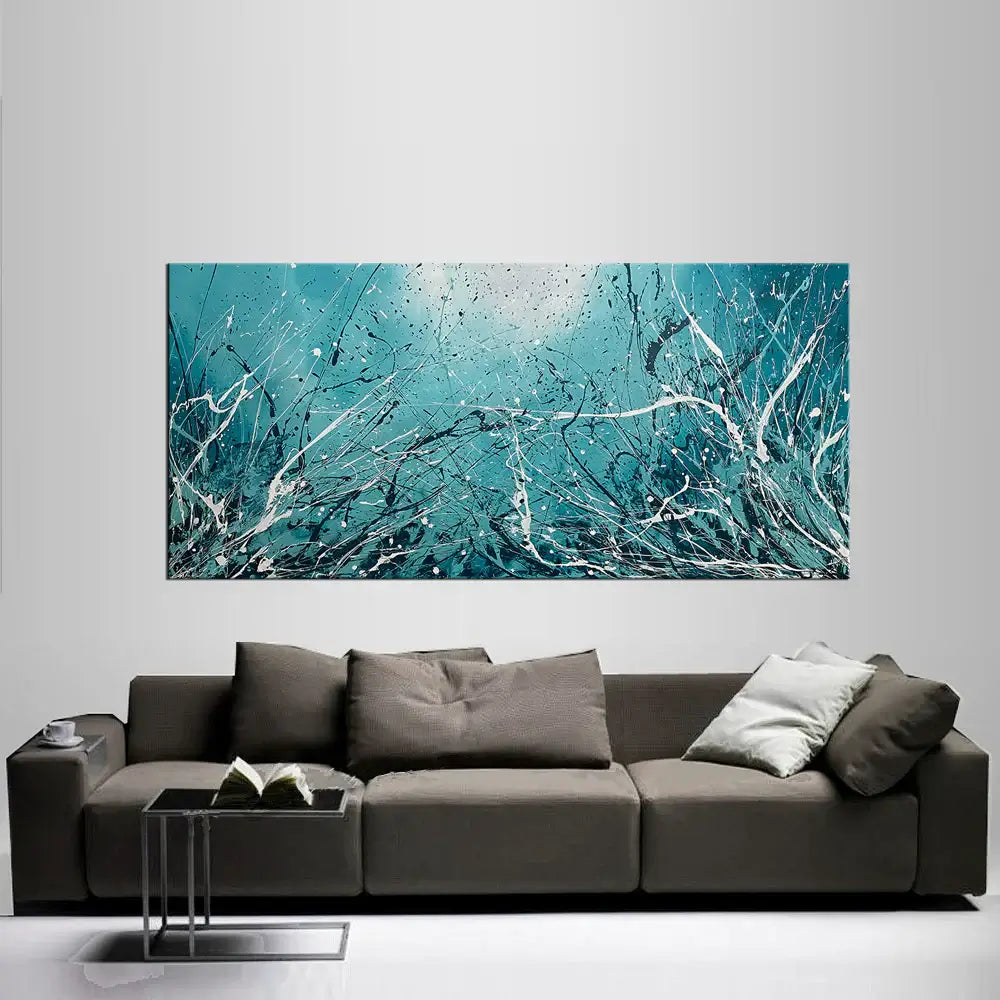 Abstract Teal Painting displayed above a modern gray sofa, showcasing elegant teal tones and abstract design.