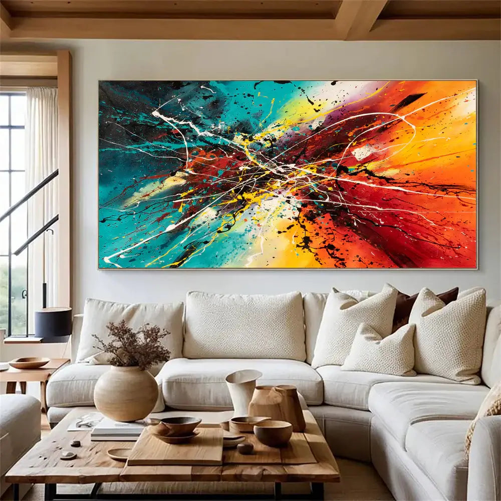 Hand-painted abstract artwork displayed in a modern living room, featuring vibrant colors and dynamic brush strokes.