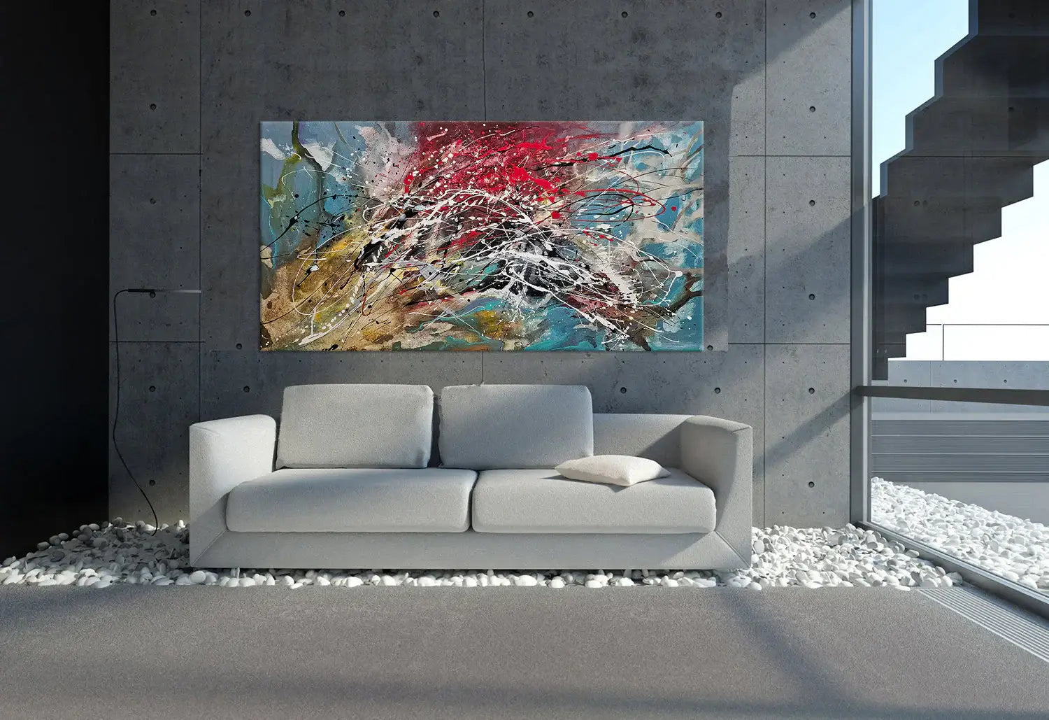 Abstract painting in Jackson Pollock style displayed in modern living room above a gray sofa.