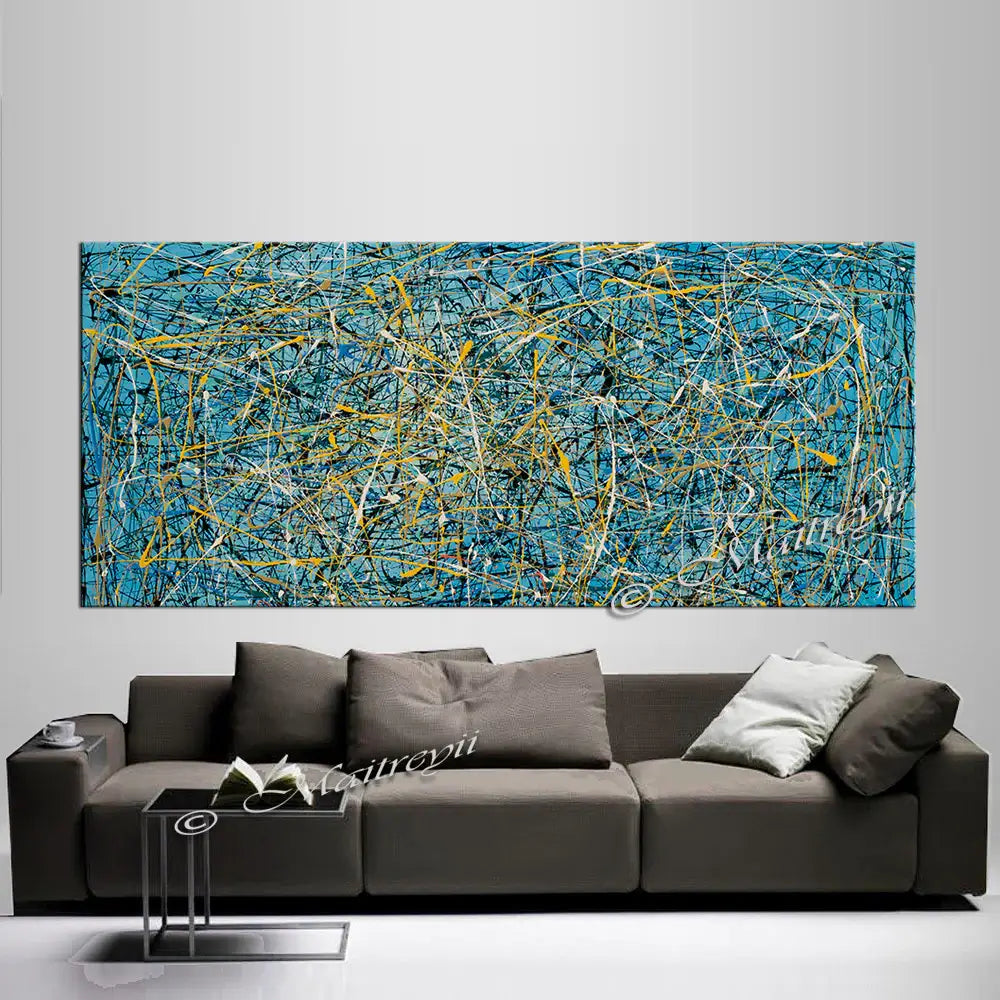 Jackson Pollock Style abstract painting in vibrant colors above a modern sofa, showcasing layered textures and dynamic motion.