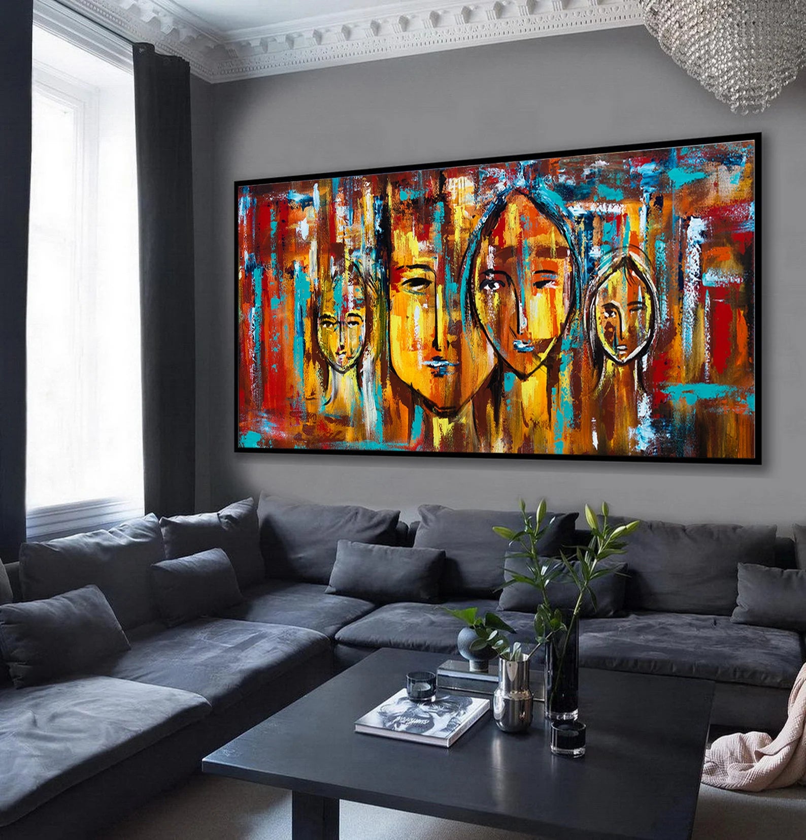 Living room with a large abstract painting on the wall above a gray sofa.
